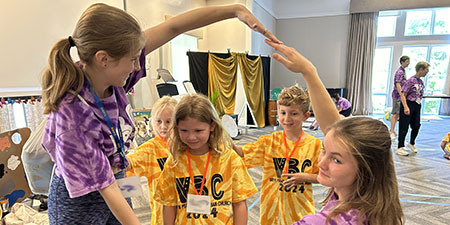 Youth volunteer at VBC camp.